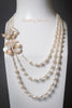 Necklace - 3-Strand White Freshwater Pearls with Keshi Peach Petal Flower Pendants