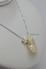 Necklace - Freshwater Keshi Peach Pearl with silver star